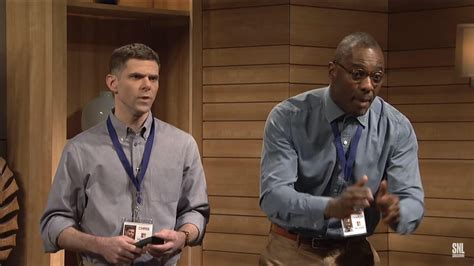 In SNL, Idris Elba hosted and in this office setting, his name tag ...