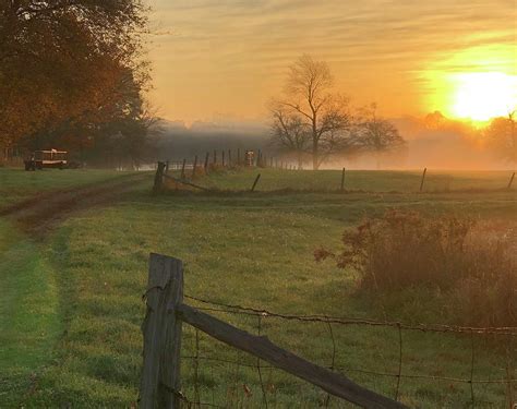 Farm sunrise in the mist Photograph by Laura Kahler - Pixels