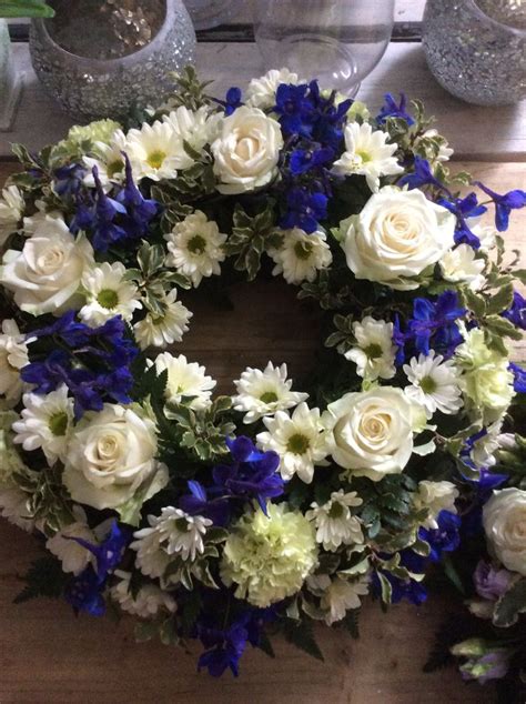 funeral wreath traditional blue and white wreath | Funeral flower arrangements, Flower wreath ...