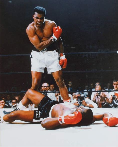 Lot - A colour photograph of Muhammad Ali and Sonny Liston.