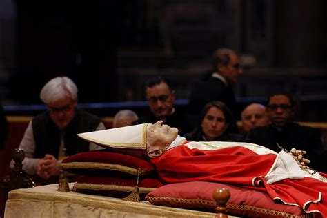 Thousands pay their final respects to Benedict XVI as his body lies in ...