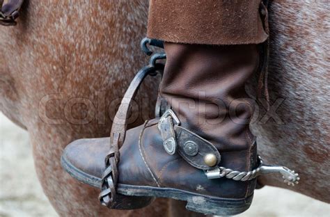 Cowboy boot with spur and horse | Stock image | Colourbox