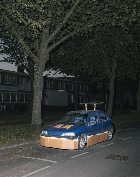 artist pimps out strangers cars at night with cardboard and tape