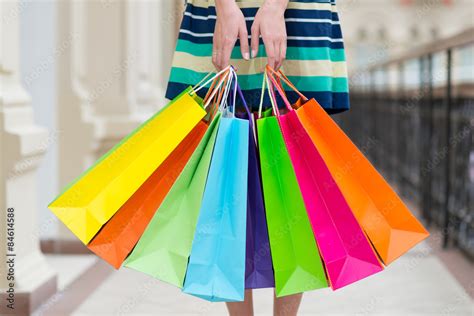 Woman holding colourful shopping bags at the mall. Stock Photo | Adobe ...