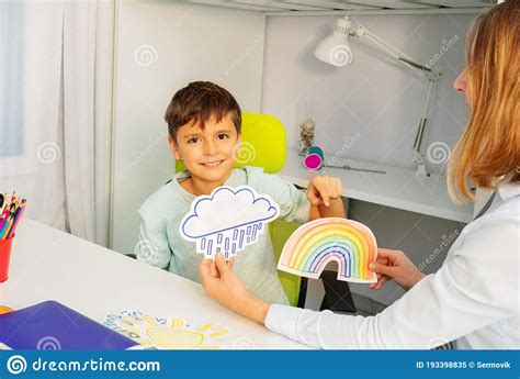 Autistic Boy during ABA Therapy with Weather Cards Stock Image - Image ...