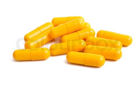 yellow capsules isolated | Stock image | Colourbox