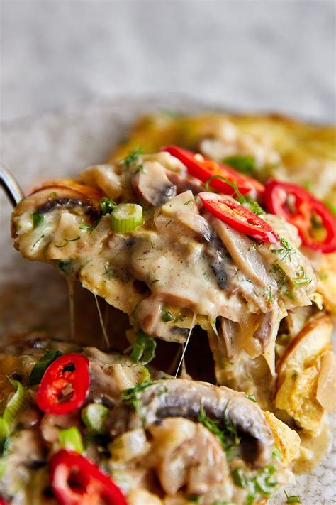 Delicious mushroom omelette with cheesy and creamy mushroom umami sauce. Served with fresh green ...