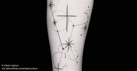 Orion constellation tattoo on the inner forearm.