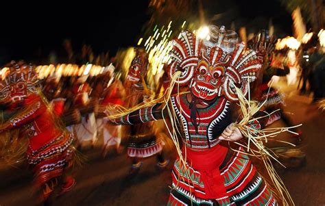 Colombo, Sri Lanka — A traditional mask dancer performs in an annual Buddhist procession ...