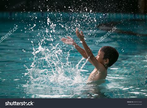 Boy Making Water Splash Swimming Pool ภาพสต็อก 693721642 | Shutterstock