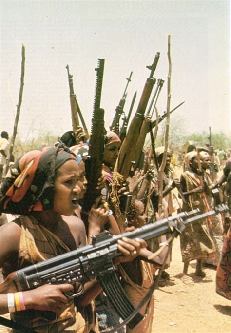 Women of the Western Somali Liberation Front hold a rally with a menagerie of small arms during ...