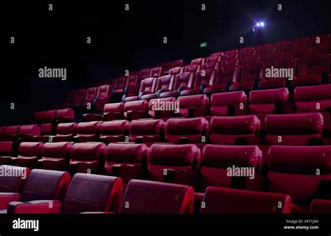 Cinema red seats in a movie theater Stock Photo - Alamy