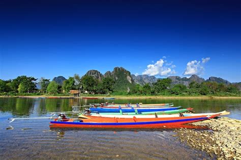 Premium Photo | Traditional boats in nam song river at vang vieng laos