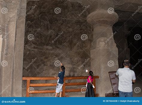 Tourists Watching Cave Sculptures on the Cave Wall Editorial Stock ...