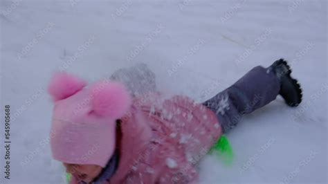 Toddler girl playing outdoors , enjoy winter time with child. Healthy activity for children. Fun ...