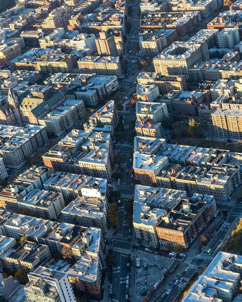 an aerial view of a city with tall buildings