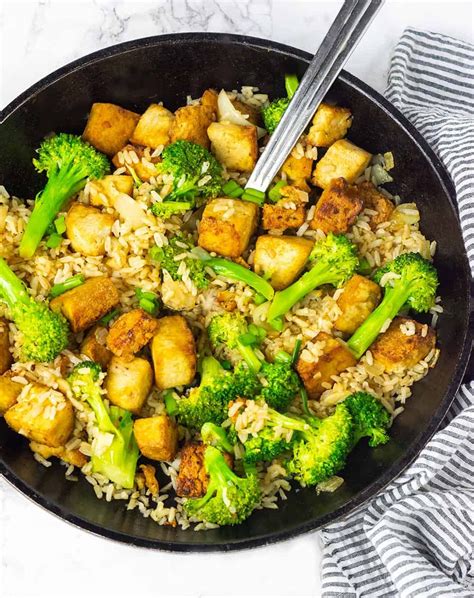 This marinated tofu fried rice is full of flavor and so easy to prepare. Tofu marinated in a ...