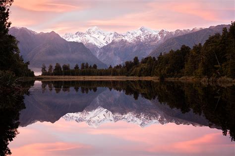 Pink Sunrise Over Lake Matheson South Island New Zealand Stock Photo - Download Image Now - iStock