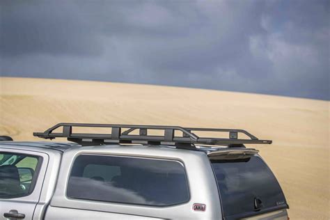 ARB BASE: The Next Evolution in Adventure Roof Racks Has Arrived | Beam structure, Gas cans ...