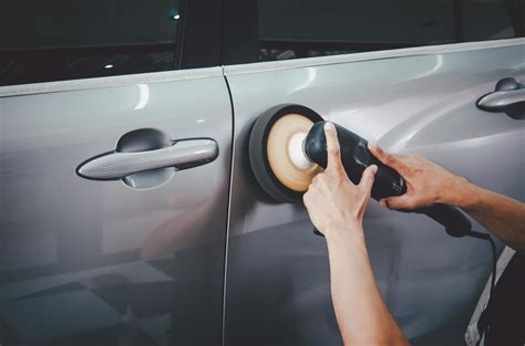 Man buffing a gray car 2125318 Stock Photo at Vecteezy