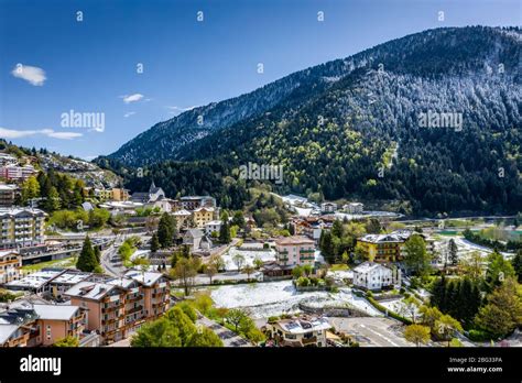 The Improbable aerial landscape of village Molveno, Italy, snow covered mountains Dolomites on ...