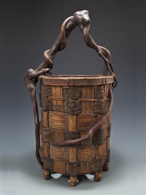 Ikebana basket, Japan. Split bamboo, mulberry bark, twisted branch and ...