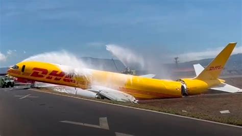 DHL cargo jet snaps in two after skidding off runway during emergency landing | World News | Sky ...