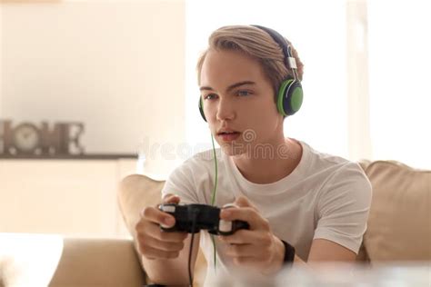 Teenager Playing Video Games at Home Stock Photo - Image of person ...