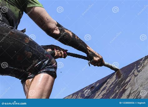 Muddy Obstacle Race Runner in Action. Mud Run Stock Photo - Image of extreme, dirty: 123800056