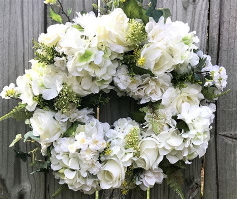 In this video, learn to use fluffy white hydrangeas, roses, dahlias and ...