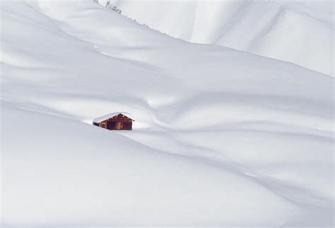 Log Cabin In Snowy Alps by Gerhard Fitzthum