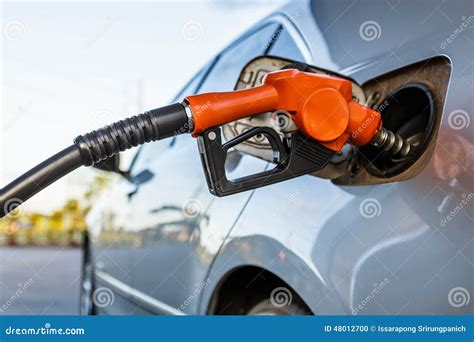 Gas pump nozzle stock photo. Image of person, benzine - 48012700