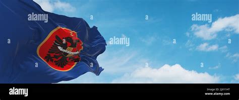 flag of Albanian peoples Kosovo Albanians at cloudy sky background ...