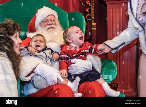 Man holds crying baby hi-res stock photography and images - Alamy