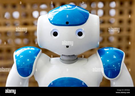 A small robot with human face and body - humanoid. Artificial ...