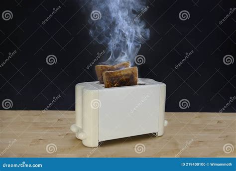 Burnt Bread Toast in the Toaster Stock Photo - Image of cook, slice: 219400100