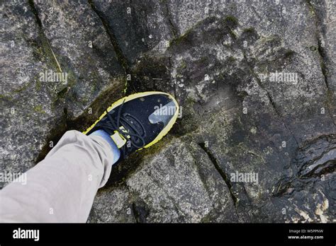 The giant fossilized human footprint is seen in a rock in Congjiang ...