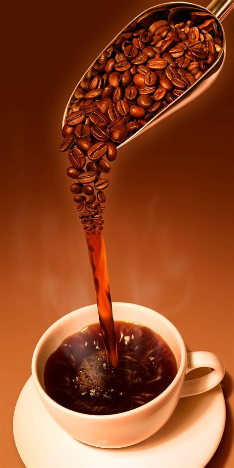 Coffee pouring into cup from scoop of fresh coffee beans Stock Images