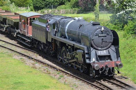 Locomotive #92214, of Britain's last class of steam locomotives, "9F," operates with a ...