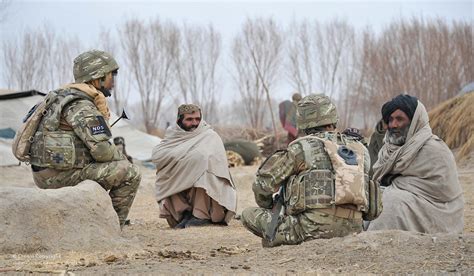 British Soldier Talking to Afghan Civilians with an Interp… | Flickr