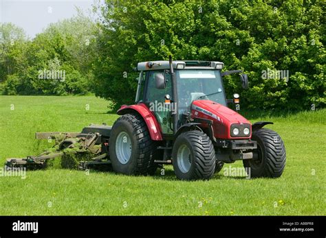 cutting grass with tractor and industrial grass cutting machine Stock Photo: 7338999 - Alamy