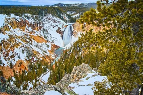 Premium Photo | Beautiful upper falls at yellowstone in winter from overlook