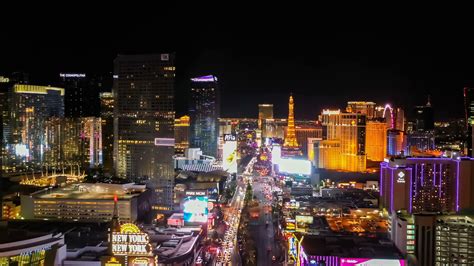 Flying over downtown Las Vegas at night with a view of hotels along the Strip. Stock Video ...