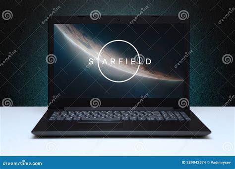 Starfield Game on the Screen Laptop Computer on Black Textured Wall with Blue Light. Editorial ...