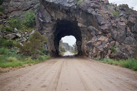 Dirt Road with Tunnel in Rock Stock Image - Image of gravel, carved: 114076441