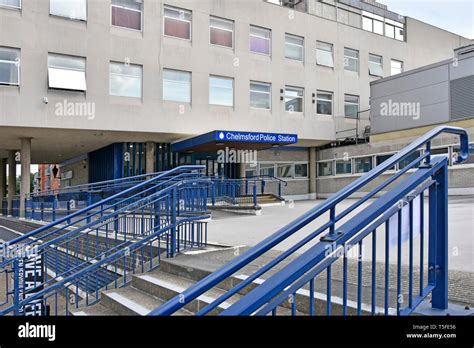 Steps & blue steel railings up to concourse & view of entrance to Essex constabulary police ...