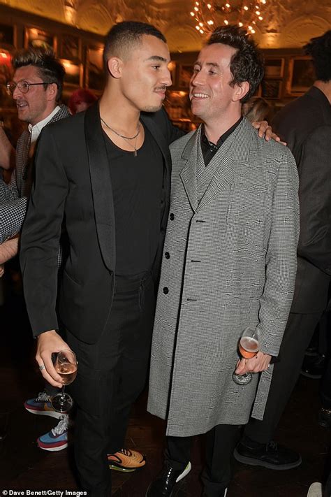 Nick Grimshaw looks in high spirits as he attends LFWM event with boyfriend Meshach Henry ...