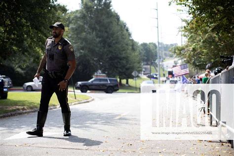 (230825) -- ATLANTA, Aug. 25, 2023 -- A police officer is seen outside the Fulton County Jail in