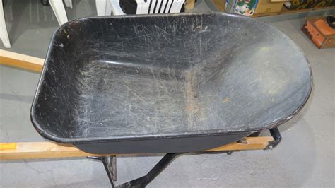 Black Metal Wheelbarrow w/ Wood Handles - Oahu Auctions