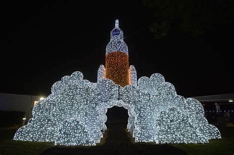 Space Center Houston sets Saturn V rocket aglow with festive 'Galaxy ...